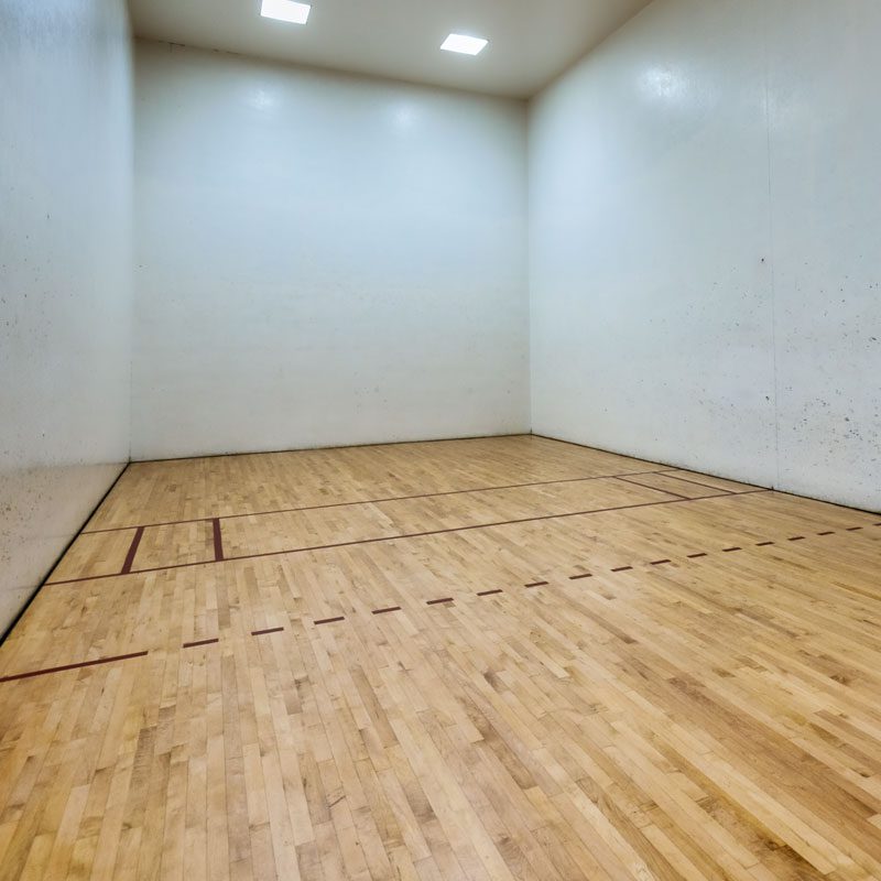 A cleared out rental room for racquetball