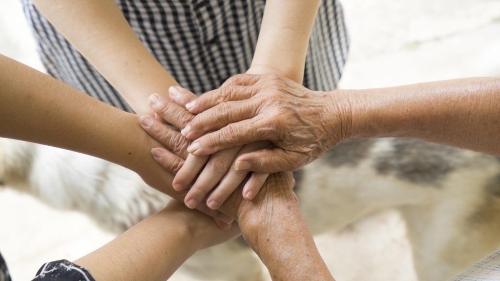 hands joined together in the Parkinson's support group